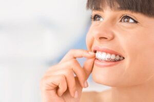 Young woman having night guard for bruxism treatment in Long Beach, CA