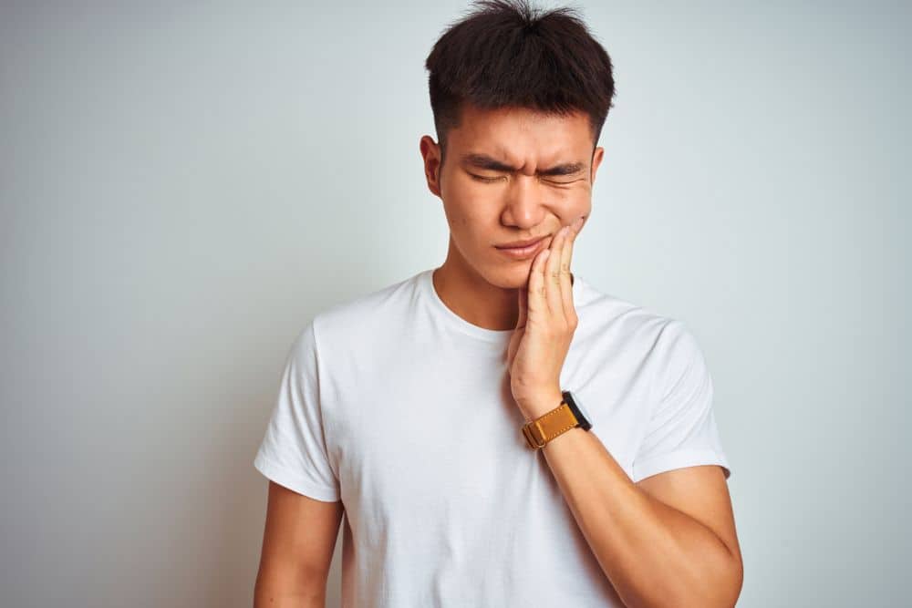 Young man suffers from tooth decay in Long Beach, CA